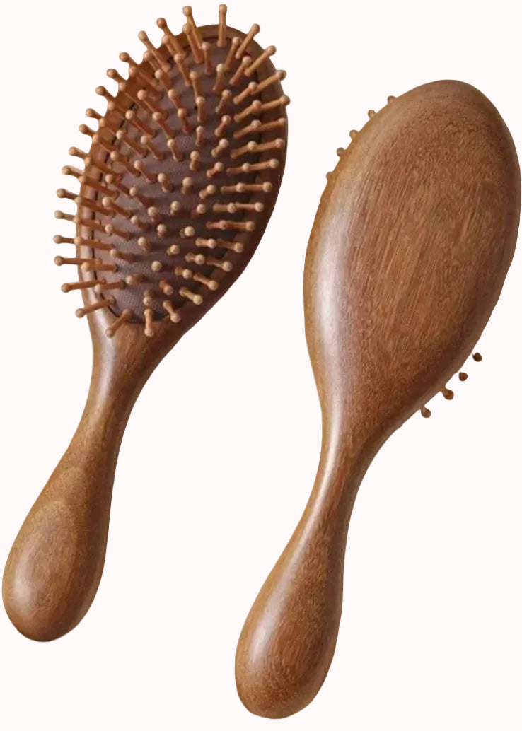 Two wooden hairbrushes on a white background
